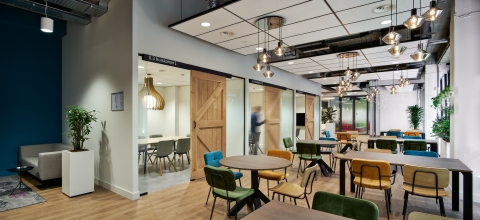 Glass partitions with wooden barn doors.