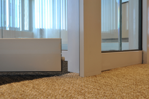 Drop seal under a tempered glass door