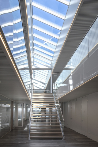 Main stairway with a lot of glass 