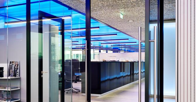 Aluminum framed pivoting door with glass at The Flow Houthavens Amsterdam.
